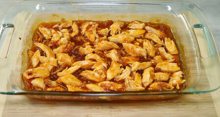 Apricot chicken casserole with chicken shredded after cooked.