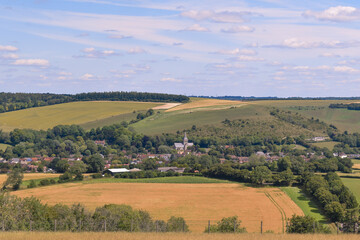 Fototapeta na wymiar Countryside Summers View on a Hill Looking at a Village 