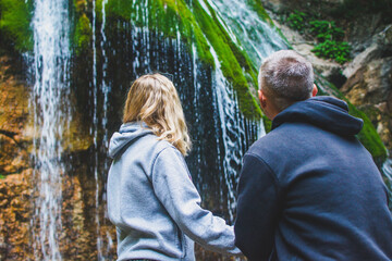 People at the waterfall