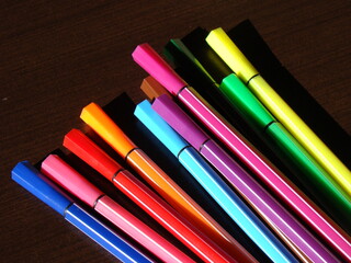 Fototapeta premium Colorful pens and pencils on a table