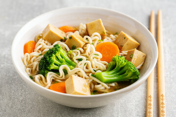 Vegan asian soup with noodles and tofu