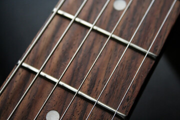 close up of guitar fret and strings