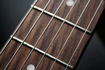 Fototapeta premium close up of guitar fret and strings