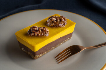 Homemade pumpkin pie with chocolate, and nuts. Decorated with walnuts.