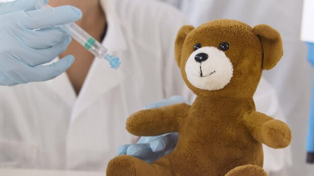 Teddy Bear Injected with a Shot Close Up