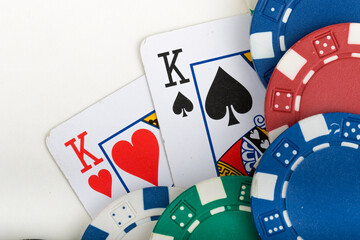 Pocket Kings, Hand Pair, Two Playing Cards and various color Casino Poker Chips. Pattern Isolated on White Background.