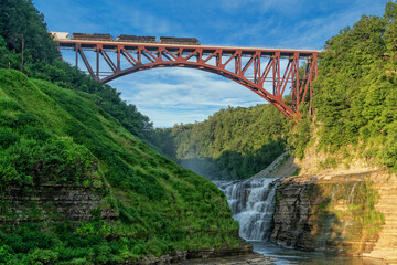 Fototapeta premium Train Crossing The Arch Bridge At Letchworth State Park
