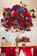 Design of a banquet hall, decoration of chairs. Festive table setting, serving. Flowers on the table.