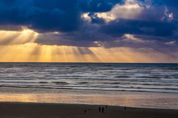 Cloudy sunset with sun rays at Seaside, Oregon