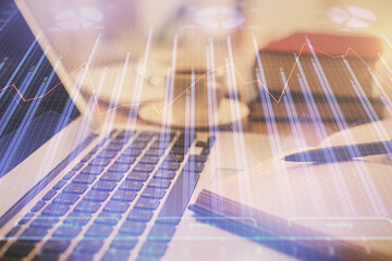 Fototapeta premium Double exposure of financial chart drawing and desktop with coffee and items on table background. Concept of forex market trading