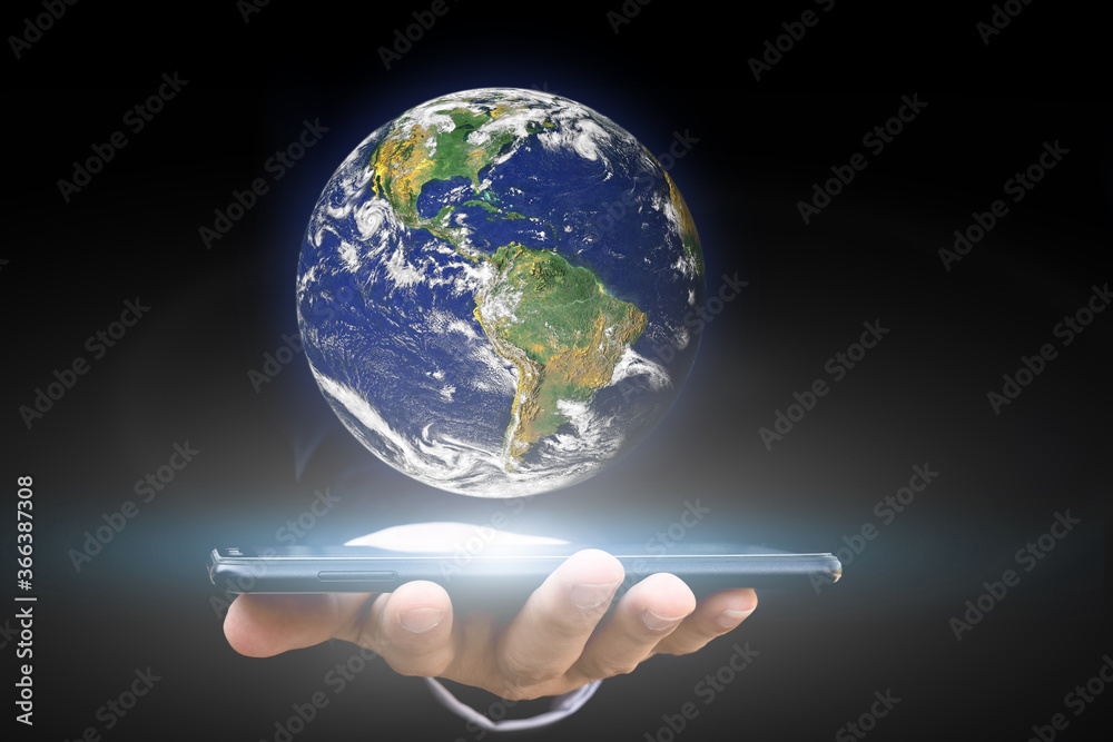Canvas Prints environment concept. hand holding smartphone with earth on black background. elements of this image 