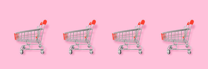 Shopping lover concept. Seamless pattern shopping cart on pink background. Flat lay composition, top view © banphote
