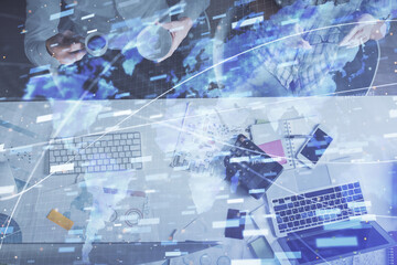 Double exposure of man and woman working together and data theme hologram drawing. Computer background. Top View.