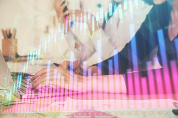 Multi exposure of woman hands typing on computer and financial graph hologram drawing. Stock market analysis concept.