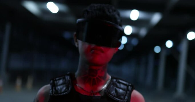 A red light falls on a person. Cyberpunk and New Fashion 202