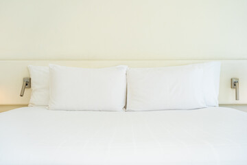 White comfortable pillow and blanket with light lamp