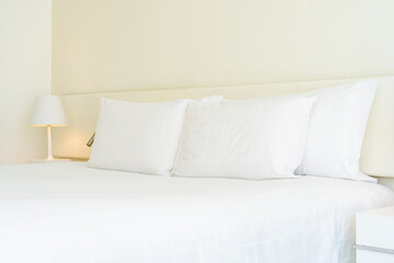 White comfortable pillow and blanket with light lamp