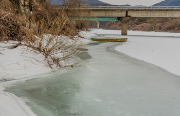 Fishing boat sitting on ice