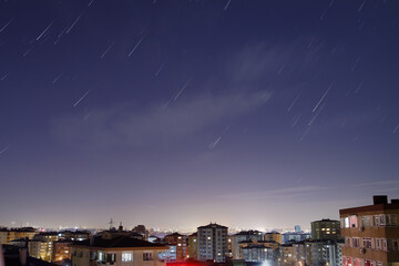 A view of the stars of the Milky Way with a mountain top in the foreground. Night sky nature summer...