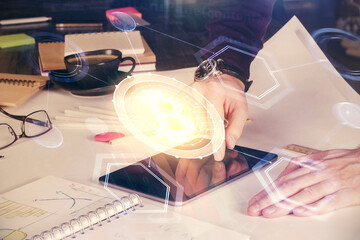 Double exposure of man's hands holding and using a phone and crypto currency blockchain theme drawing.