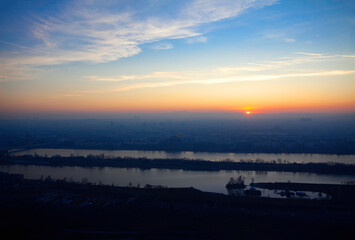 Hazy Panorama of Vienna in the Evening . Sundown over the city 