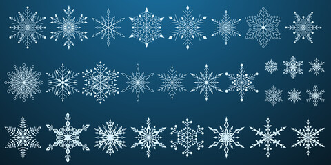 Set of beautiful complex Christmas snowflakes, white on blue background