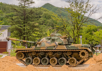 Fototapeta na wymiar Side view of camouflaged tank