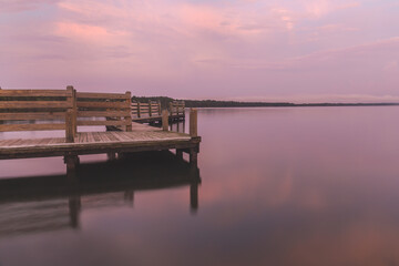 Calm sunset at lake in North Carolina with pier