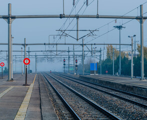 Fototapeta na wymiar Train track covered with heavy fog.