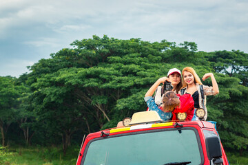 Group of happy traveler on hiking car.  Summer vacation. Travelling, hiking