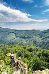 Carpathian mountains on the territory of Ukraine. Spring, Summer and Autumn in the Mountains. Mountain ranges and peaks. Sky and clouds. Ruins and rocks.