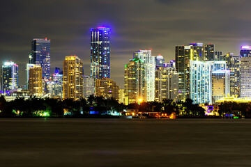 Miami business district, lights and reflections of the city lights. Miami night downtown, city Florida.