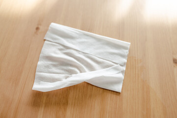 hand cleaning woooden coffee table with disinfectant wet wipe concept of the new normal after...