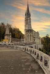 View of the cathedral in Lourdes, France at sunset