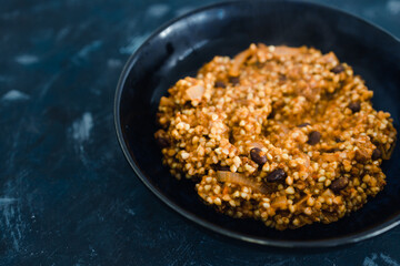 plant-based food, vegan buckwheat with beans in tomato sauce