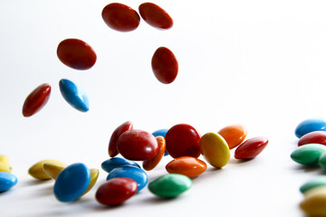 Colorful chocolate candy on white background