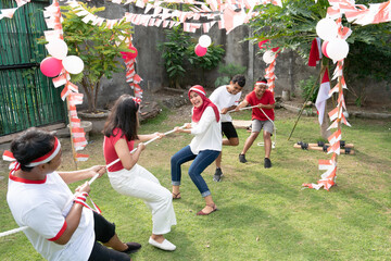 two groups of young people competed in tug of war in the Indonesian Independence Day commemoration...