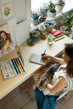 Artist Creative Designer Illustrator Graphic Skill Concept. On the table are brushes, paints, sketchbooks, and blank canvases. Workplace.