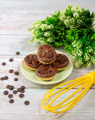 chocolate tart brownies with raisin on green dish