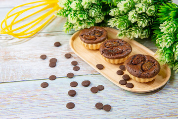 chocolate tart brownies with raisins on wooden dish