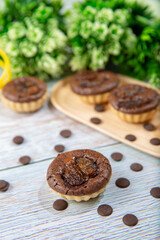 chocolate tart brownies with raisins on wooden dish