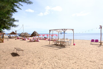 Chair umbrella and lounge on the beautiful beach sea ocean on sky 