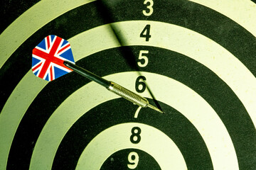 Dart with British flag board with darts in aim, with selective focus