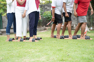 Fototapeta premium many people legs in the traditional bakiak race in celebration of Indonesia's independence anniversary