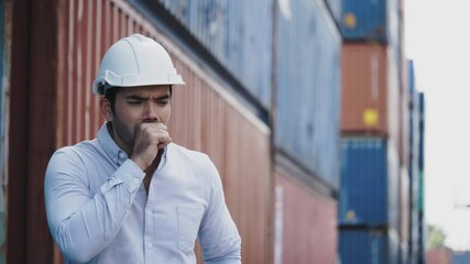 Portrait of a construction worker wearing a hard hat and mask While working in the workplace Such as container, factory, warehouse For safety during work. Concept Prevent Coronavirus