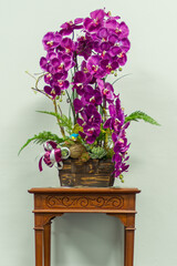 Purple orchid flowers placed on a wooden table