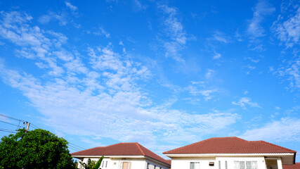 House with background of blue sky and cloud