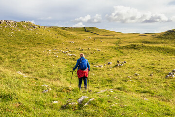 Female hill walker on the monks trail from Arncliffe to Malham Tarn in the yorkshire Dales