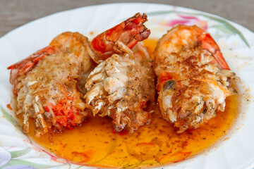 Fried shrimp with salt on pan