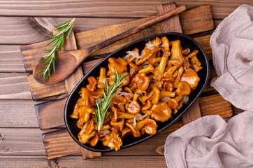 Fried chanterelle mushrooms with onions and rosemary